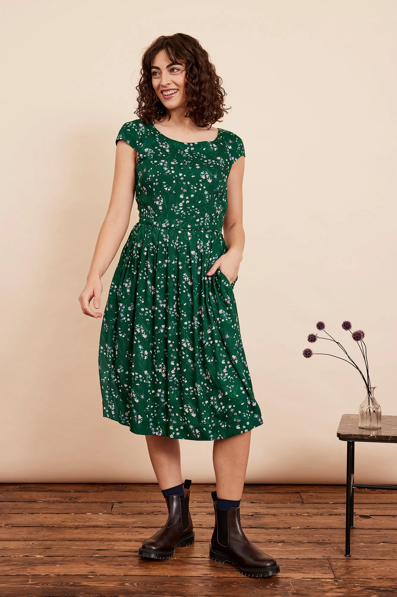 Certainly! A good optimized title for the product should include descriptive keywords and modifiers to enhance searchability and appeal. Here is an optimized version:

Claudia Womens Floral Woodland Walk Sundress - Casual Summer Midi Dress